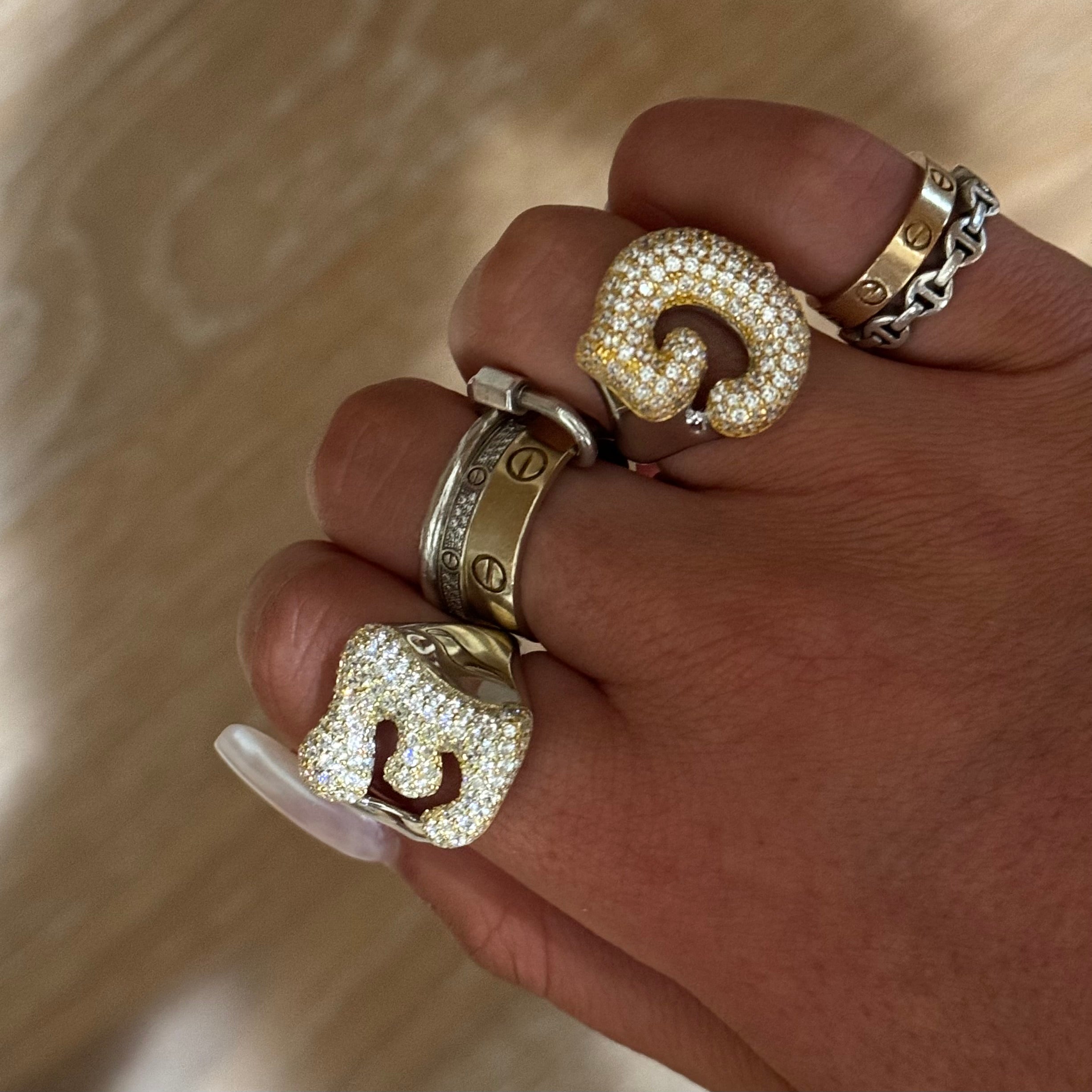 Hand stacked with Iced Jumbo Letter Rings in G and C