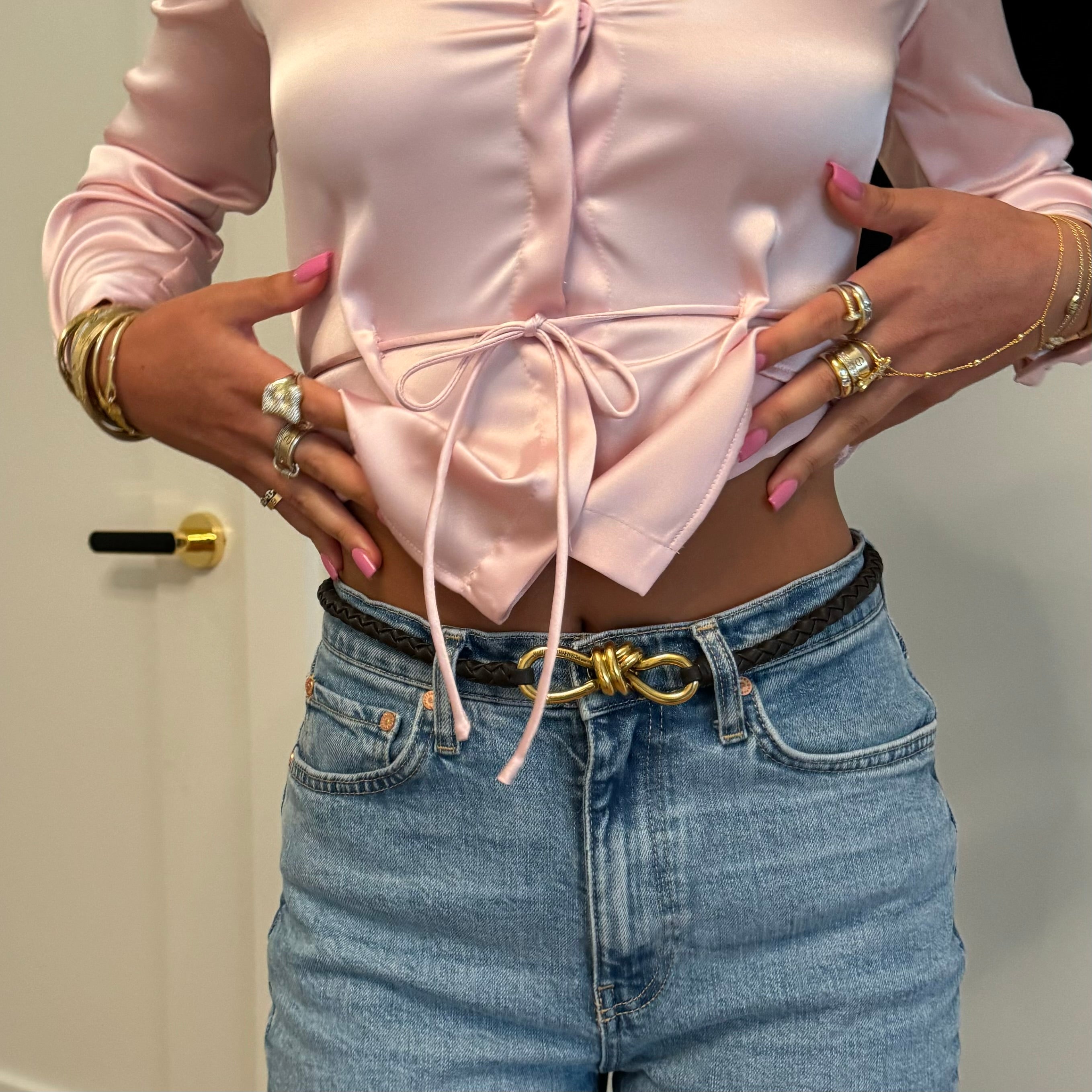 Model in a pink satin top wearing Iced Jumbo Letter Rings