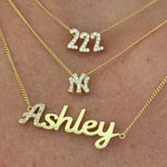 Baby Angel Number Necklace in 222 layered with a NY pendant and script nameplate