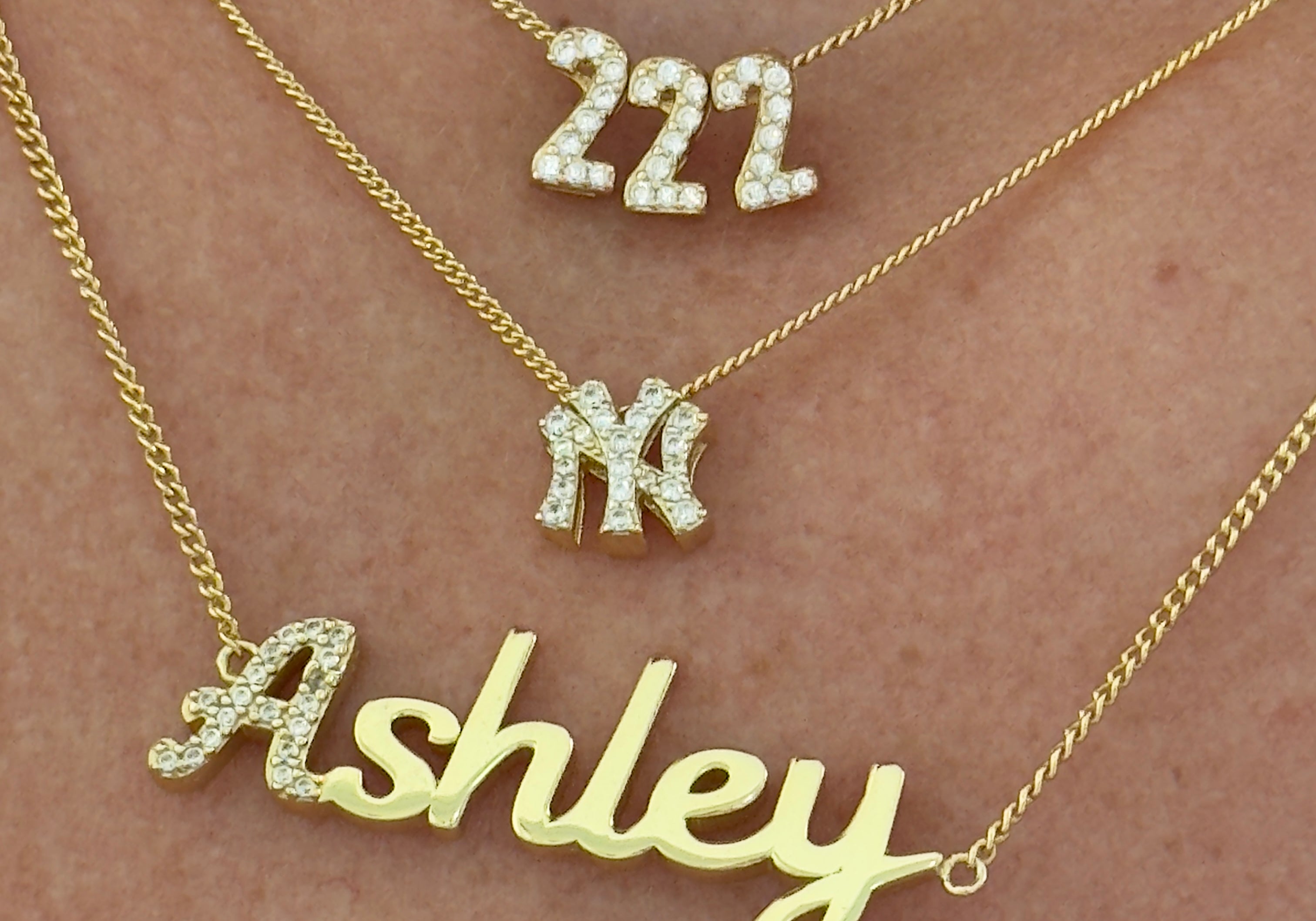 Baby Angel Number Necklace in 222 layered with a NY pendant and script nameplate