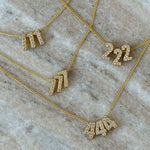 Baby Angel Number Necklaces in 111, 222, 777 and 444 on marble