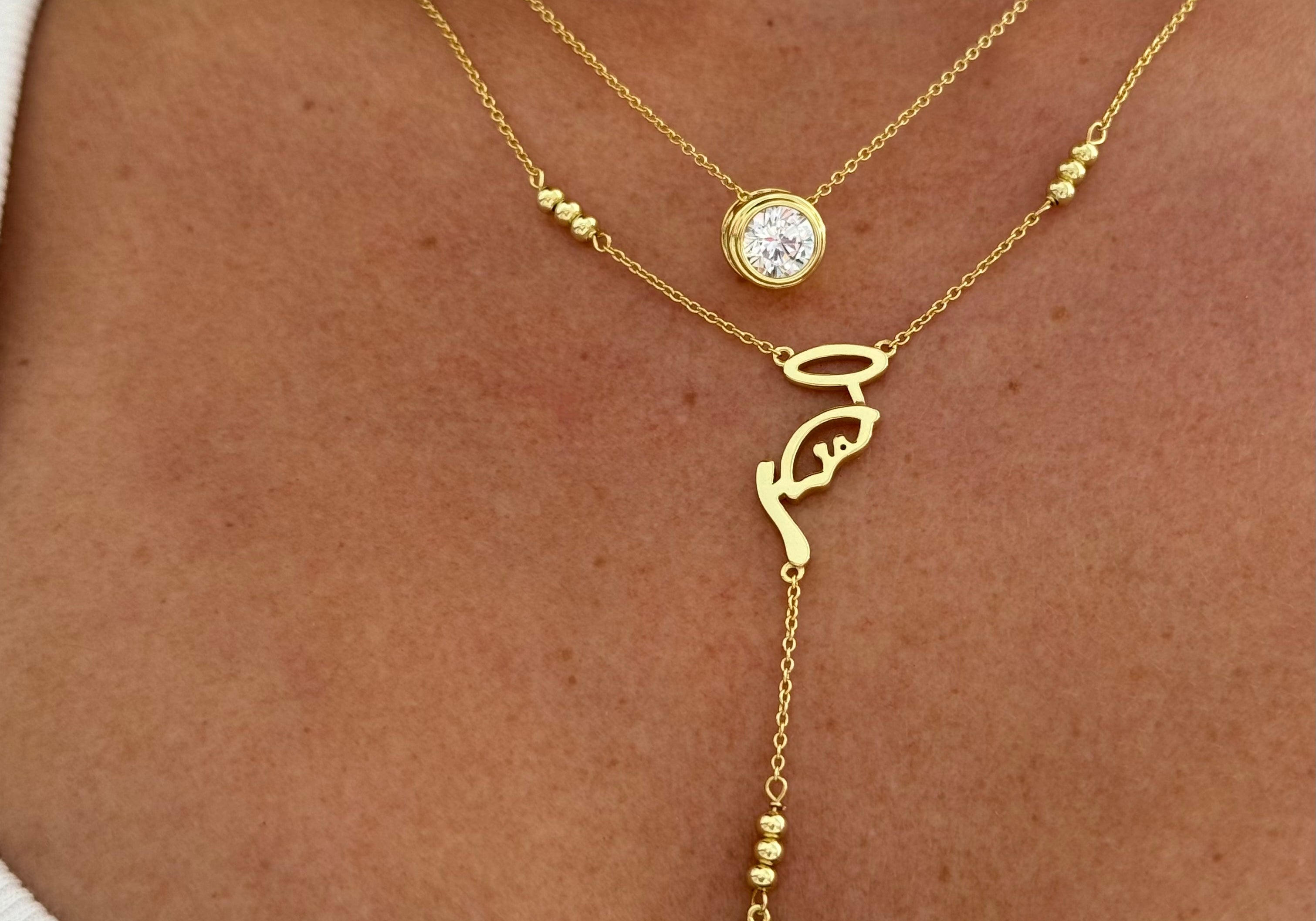 CZ Bezel Necklace layered with a script lariat and cross necklace