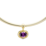 Birthstone Necklace with a purple birthstone pendant on a gold cuff necklace