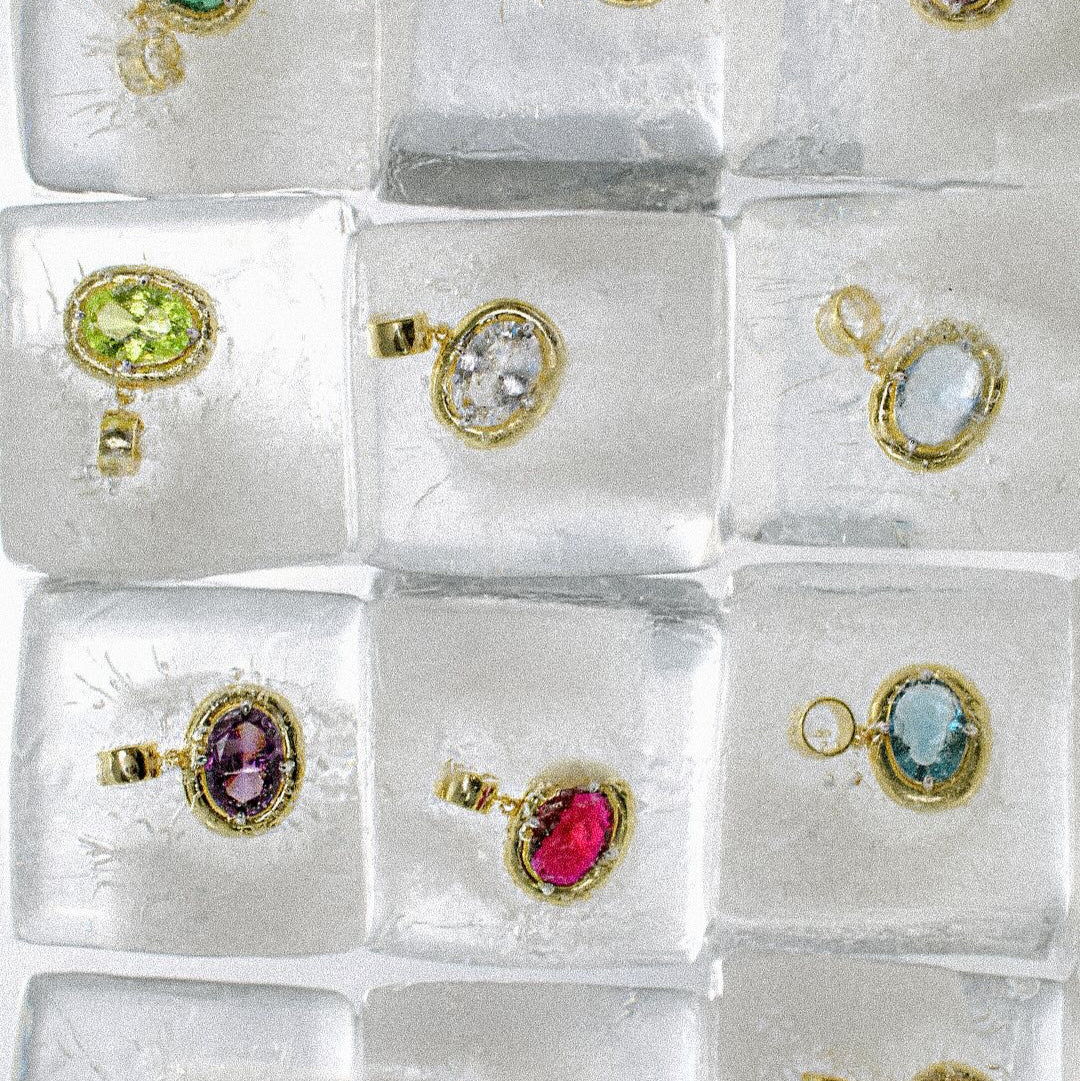Birthstone Necklace pendants in purple, pink, green, clear and blue set on ice cubes