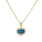Birthstone Necklace with a blue birthstone pendant on a gold box chain