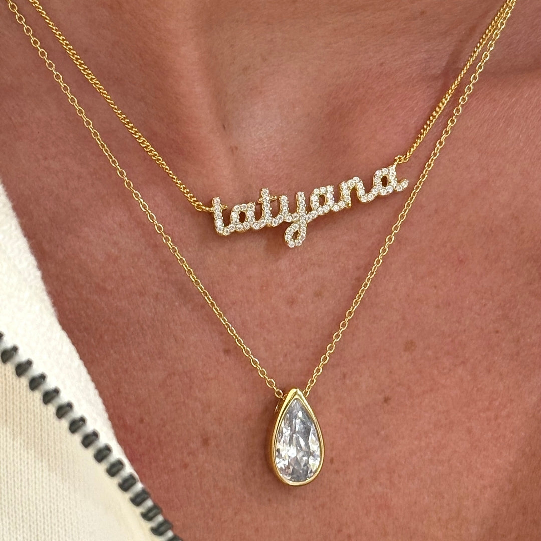 CZ Baby Script Nameplate in tatyana layered with a CZ Teardrop Necklace