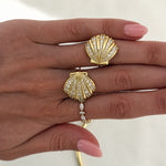 Hand holding a pair of CZ Shelly Earrings