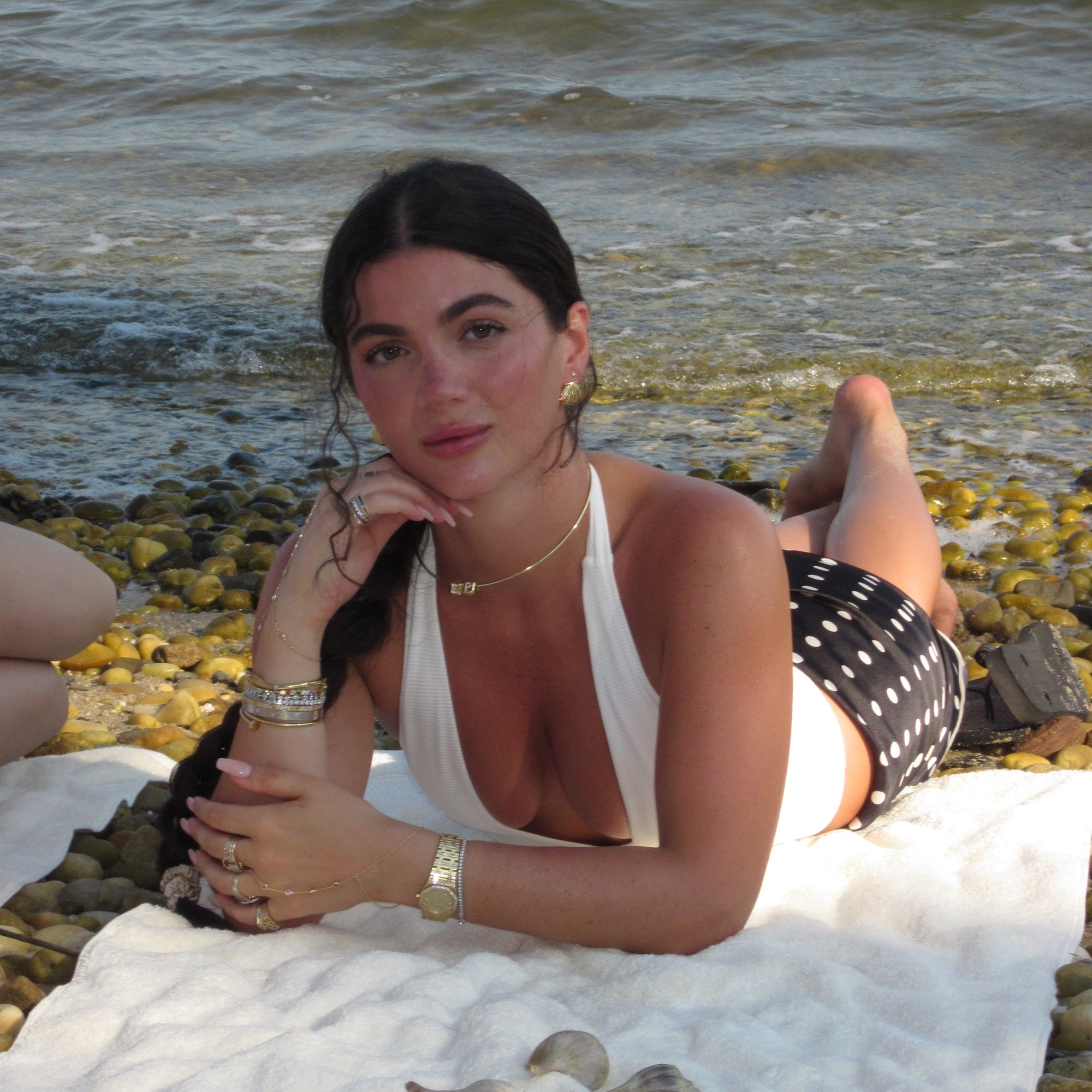 Model on the rocks wearing the CZ Shelly Earrings
