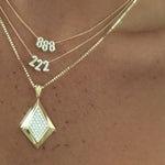 CZ Taylor Necklace layered with gold angel number necklaces