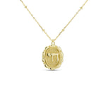 Chai Pendant Necklace, a gold medallion with a pave Chai symbol on a beaded chain