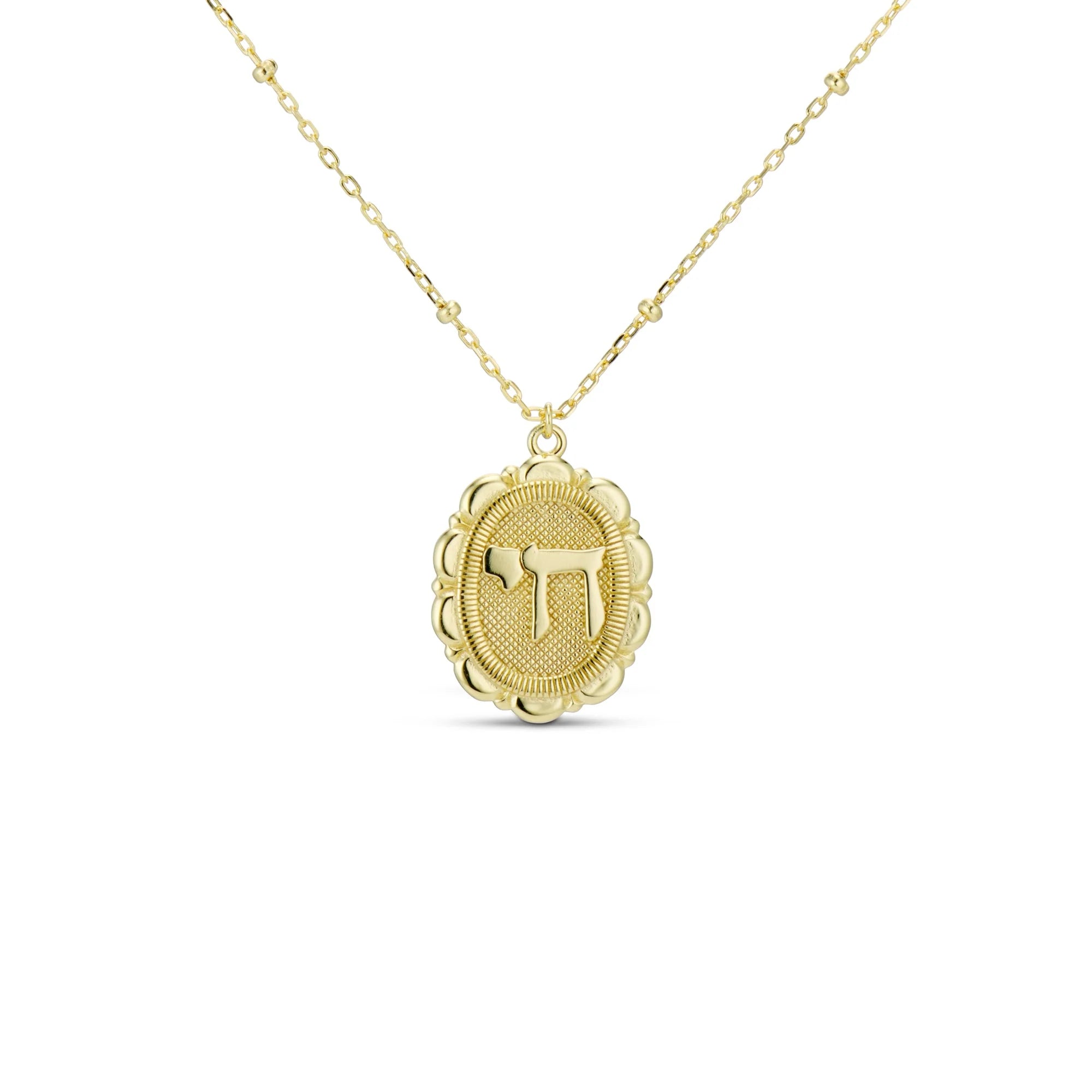 Chai Pendant Necklace, a gold medallion with a pave Chai symbol on a beaded chain