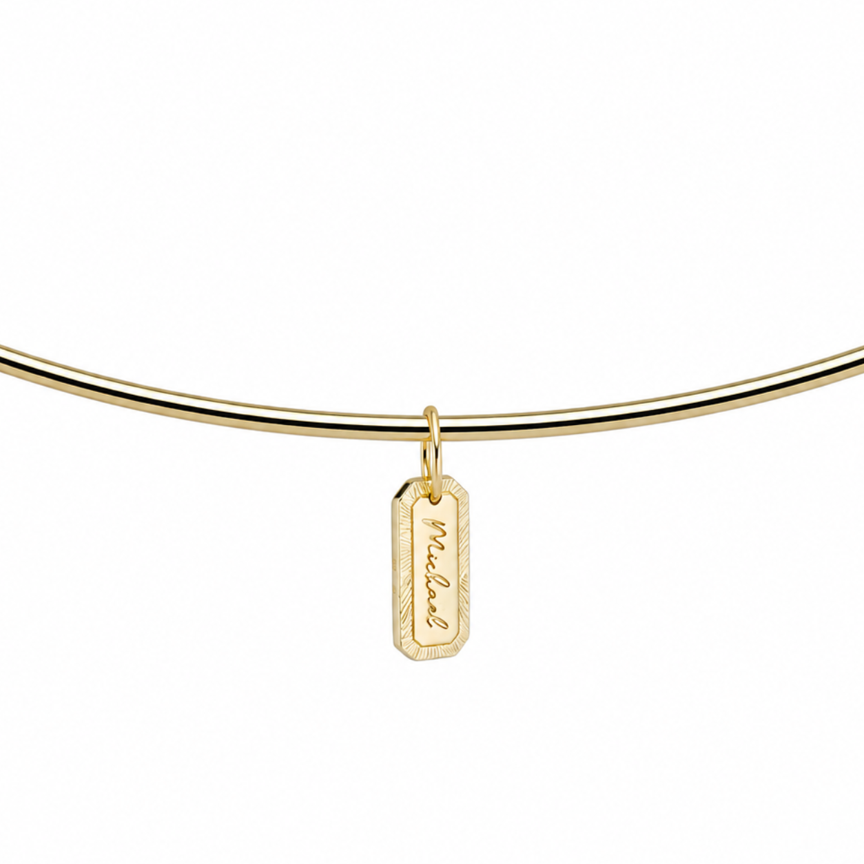Engraved Tag Nameplate on a gold cuff, side view