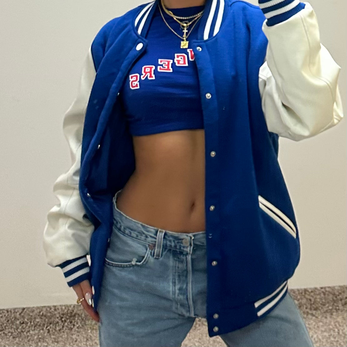Model in a Rangers varsity jacket wearing the Classic NY Rangers Necklace