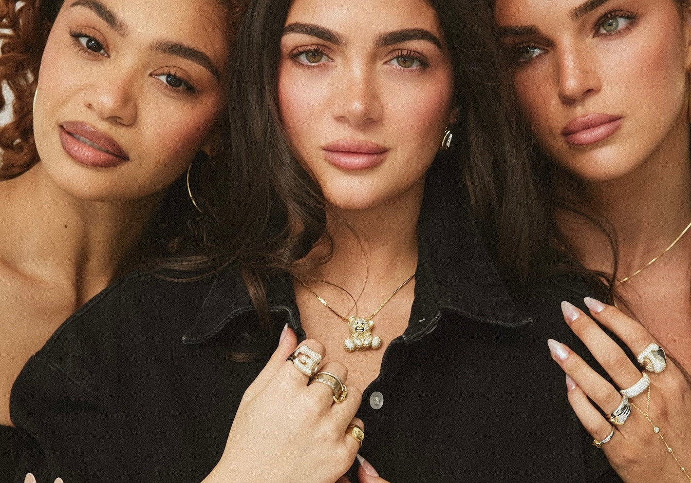 Three models in black wearing Iced Jumbo EP Teddy Necklaces