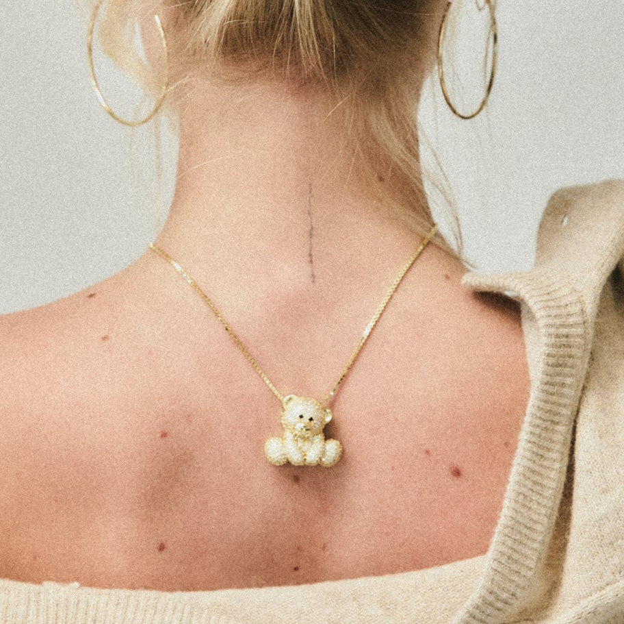 Iced Jumbo EP Teddy Necklace worn down the back with an open-back sweater
