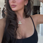 Model in a black tank taking a selfie wearing the Iced Jumbo EP Teddy Necklace