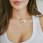 Model wearing the Engraved Tag Nameplate on a gold cuff