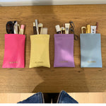 EP Jewels hair pin pouches in hot pink, butter yellow, lavender and baby blue holding hair pins