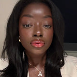 Woman wearing a gold iced medium jumbo letter A necklace