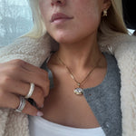 Model in a sherpa jacket wearing the Iced Kaete Pave Pinky Ring