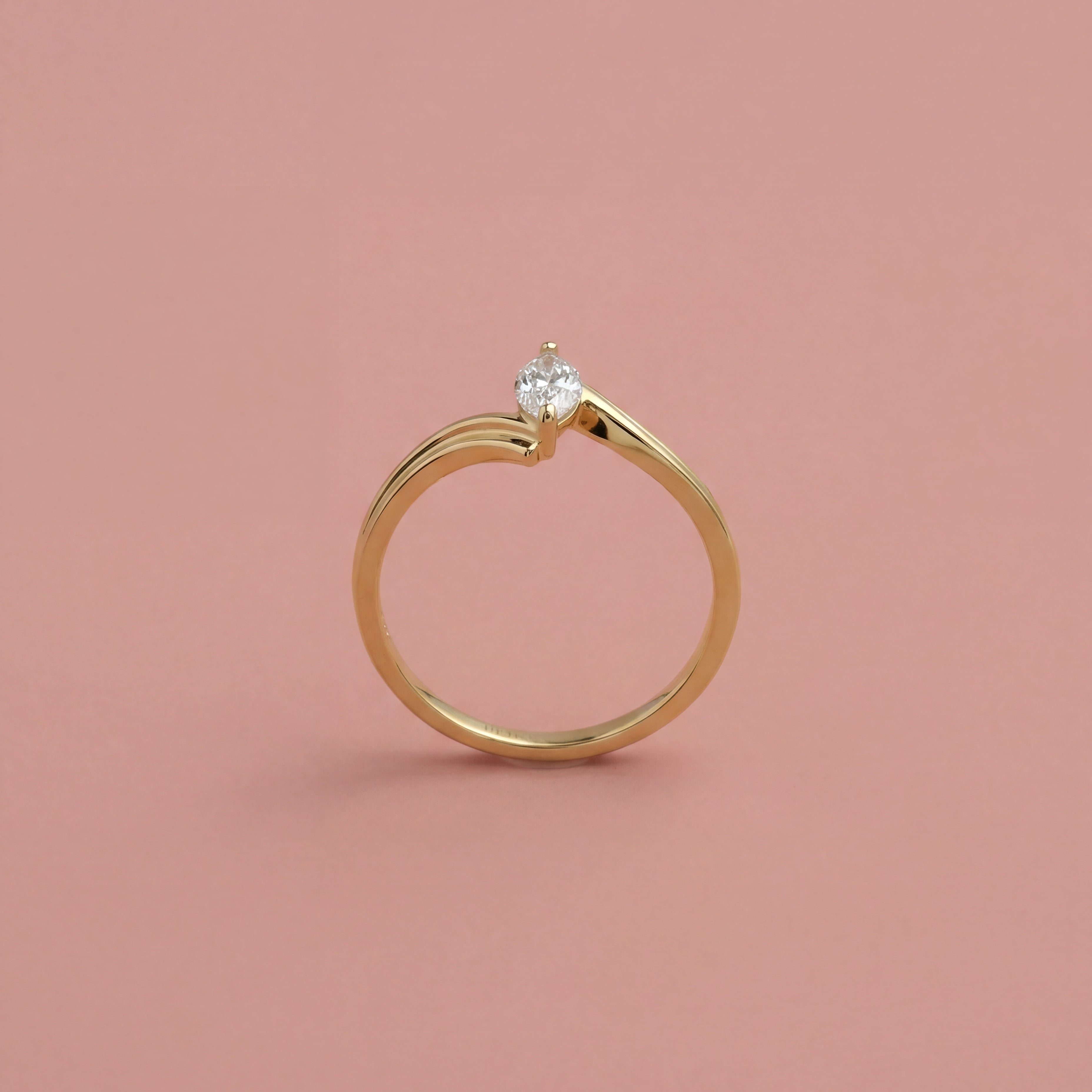 Marquise Dainty Bolt Ring in 14K solid gold on a pink background