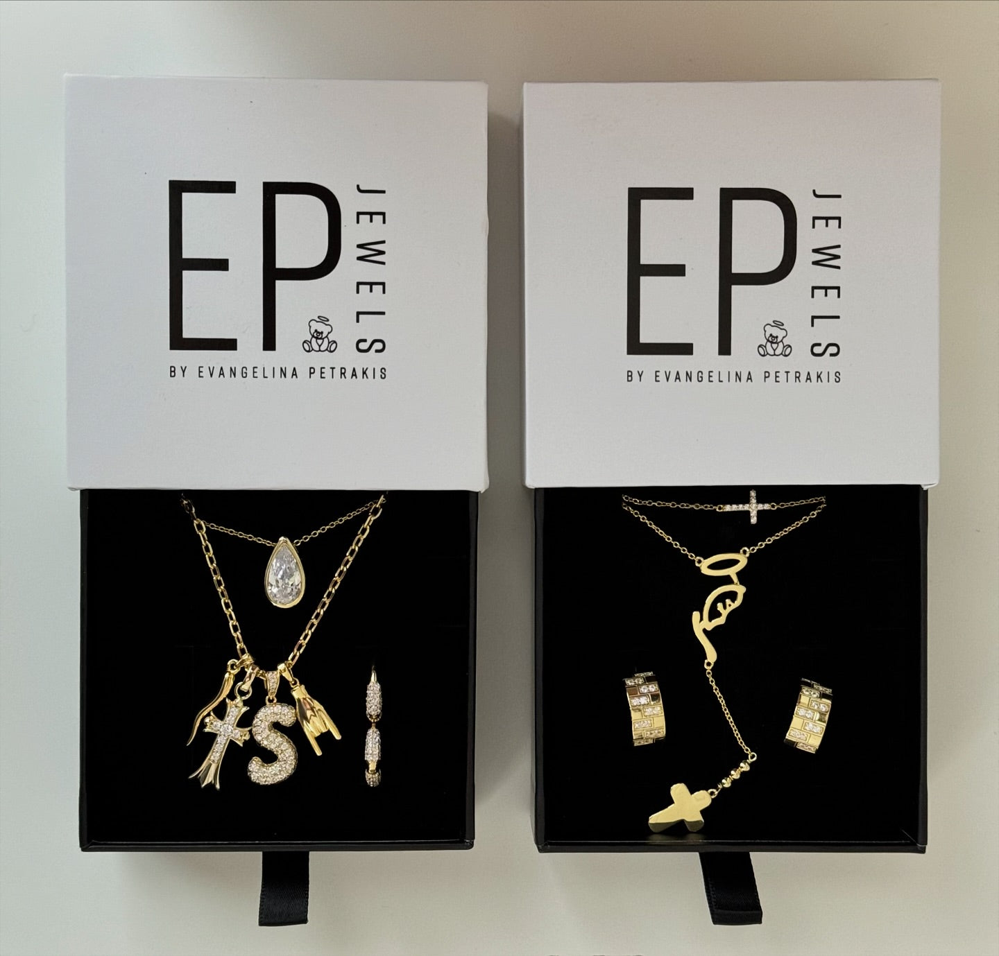 Mother Mary Rosary Necklace in an EP Jewels gift box beside other gold necklaces