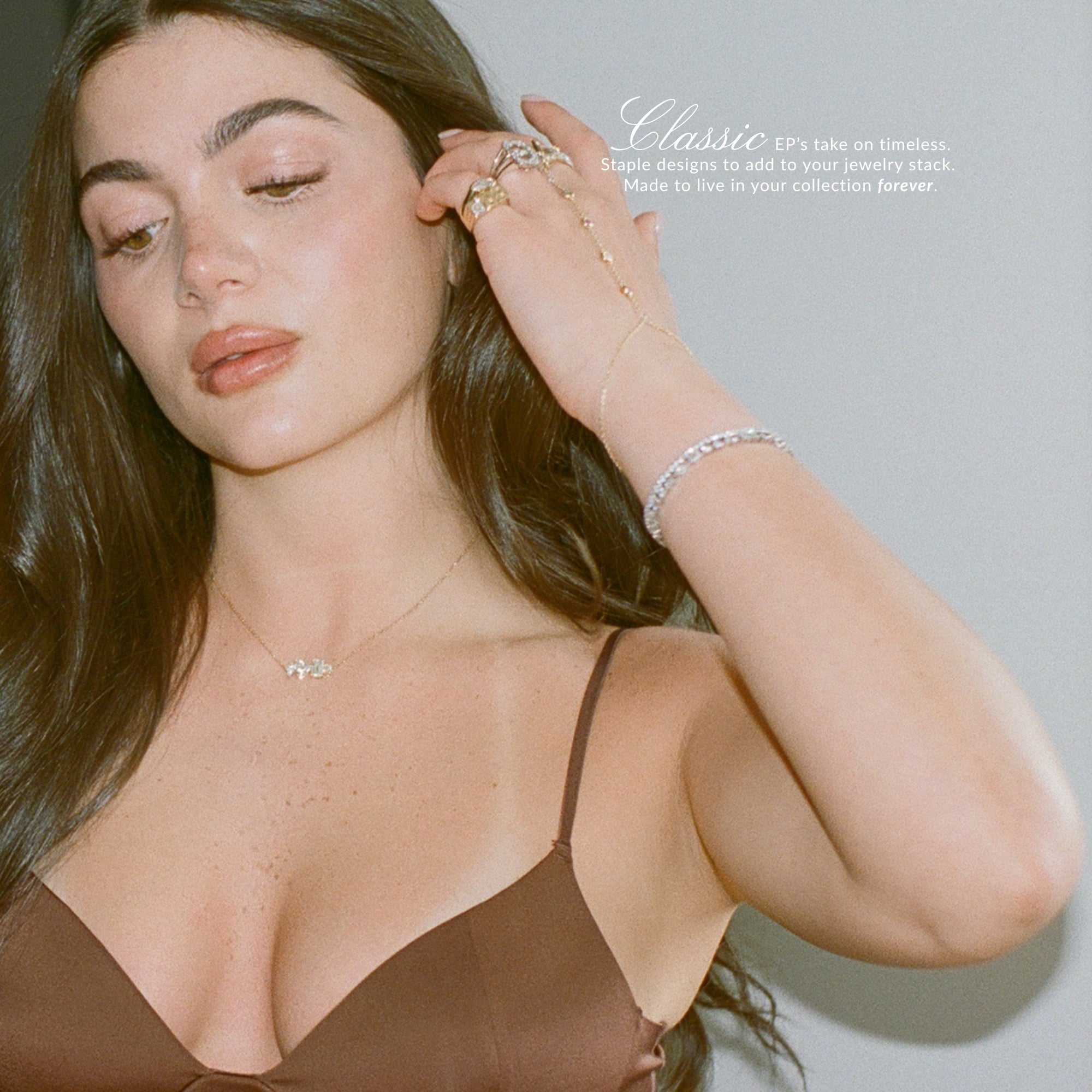 Model in a brown bralette wearing the Multi Shape Diamond Necklace and a diamond tennis bracelet