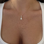Pear Dangle Diamond Necklace worn on the neckline, 14K solid gold with an IGI Certified Lab Diamond