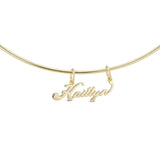 Signature Script Nameplate Charm on a gold cuff