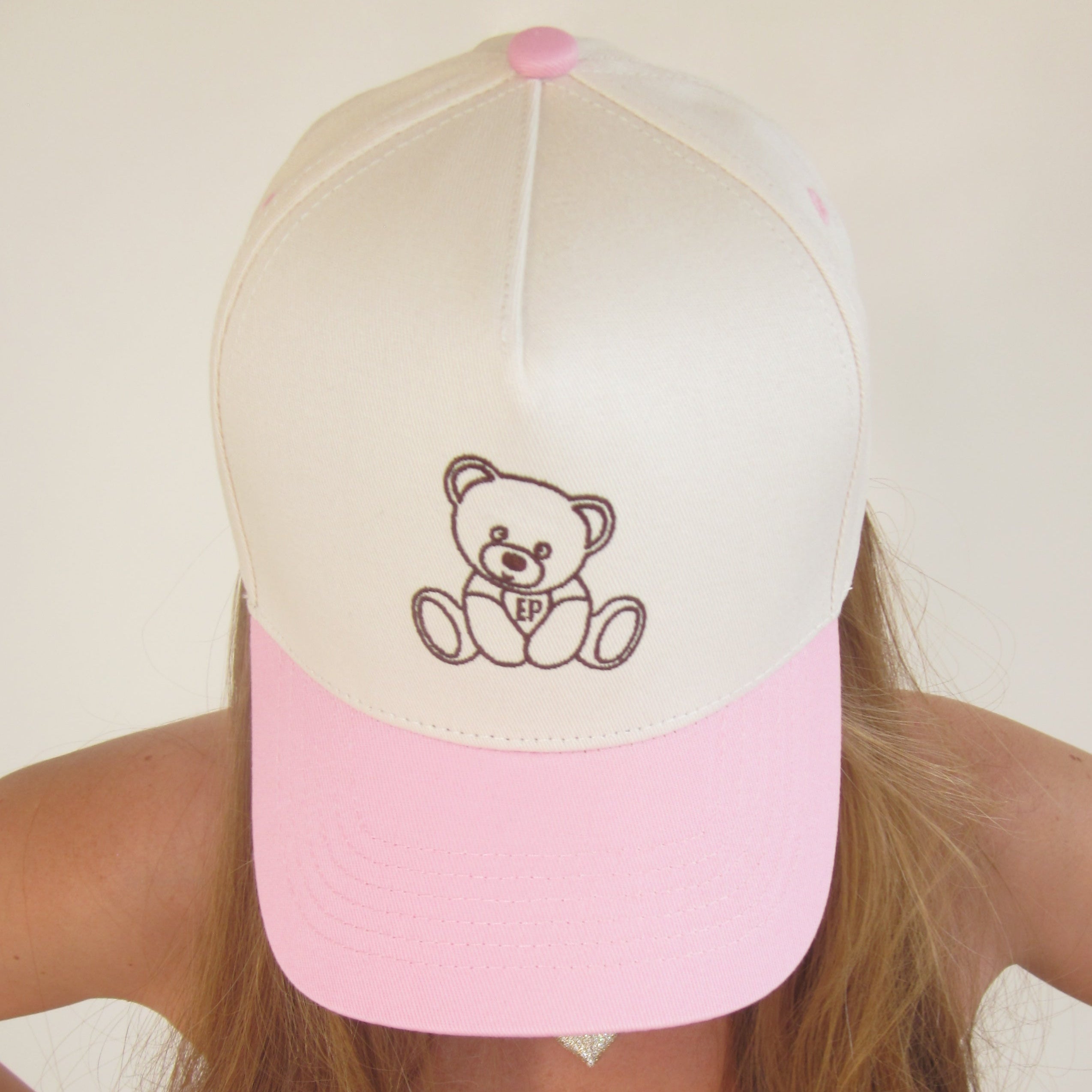 Close-up of the pink EP Teddy Trucker Hat worn on the head