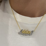 Close-up of the Two Tone Script Nameplate Necklace worn