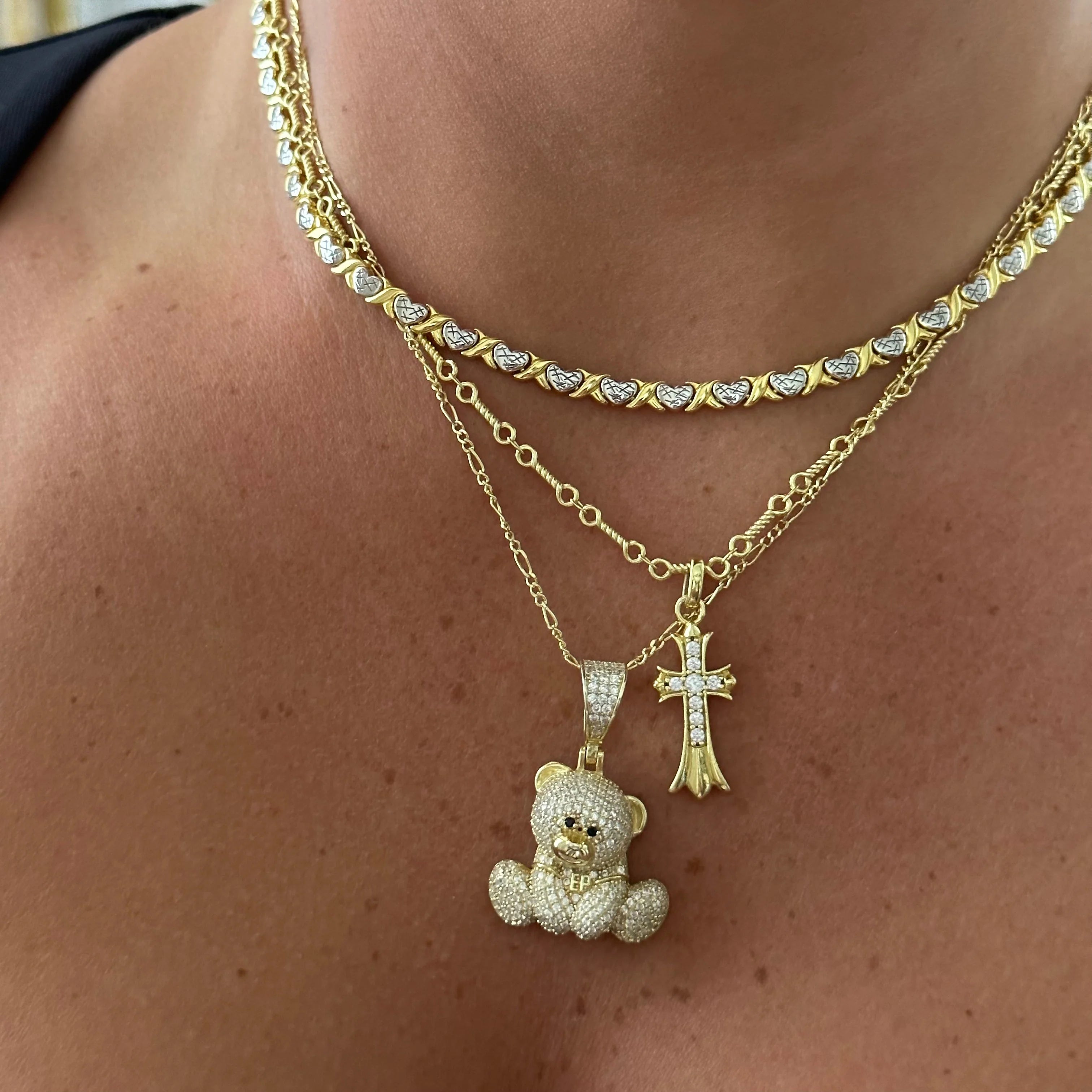 XOXO Necklace layered with a gold Iced EP Teddy Necklace and cross necklace