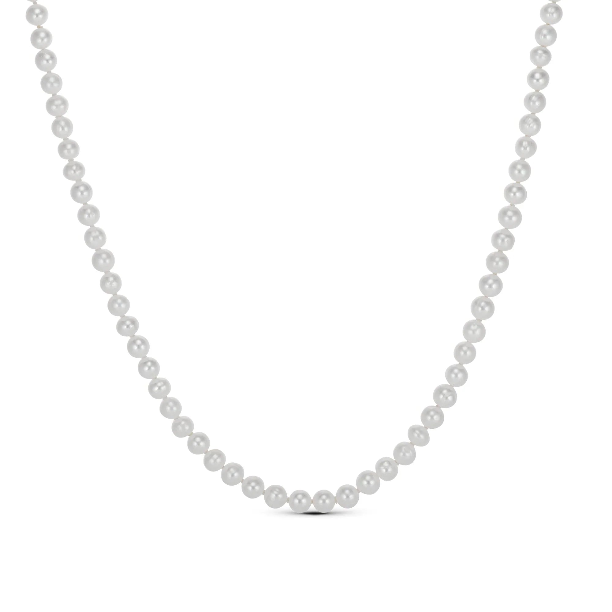 Classic Pearl Necklace laid out to show its 16 inch length plus extender